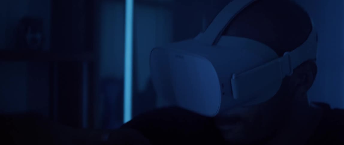 A man playing a video game with a virtual reality headset