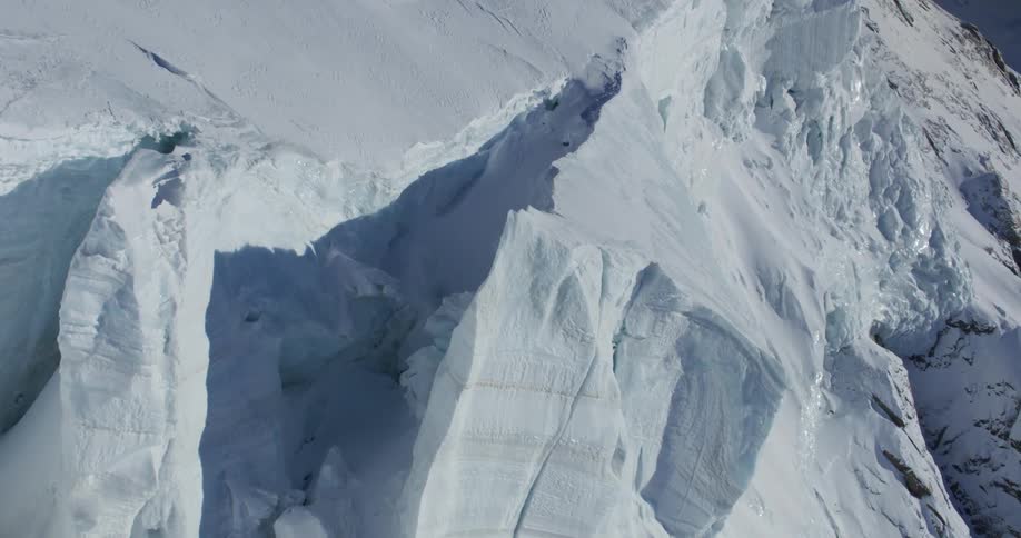 Snow covered mountains are displayed during winter