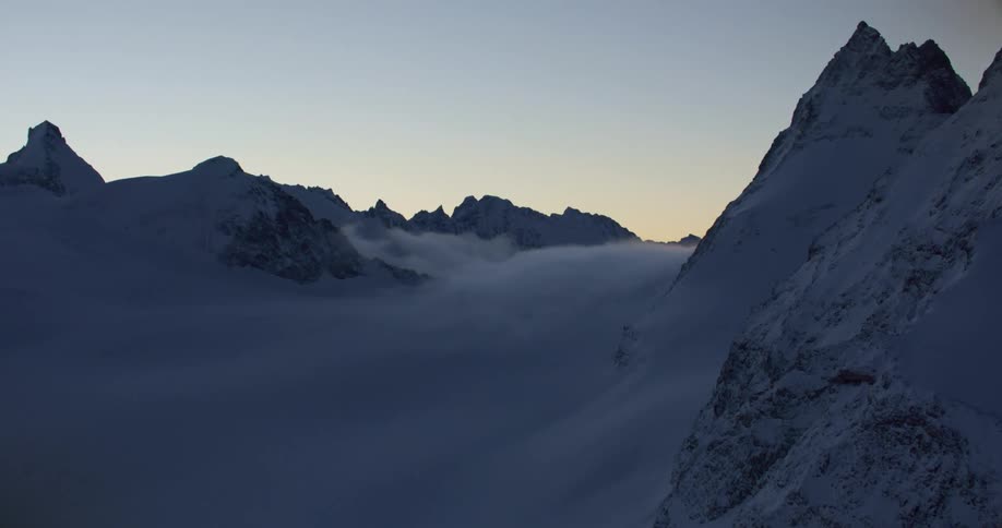 The sun is rising on the mountain