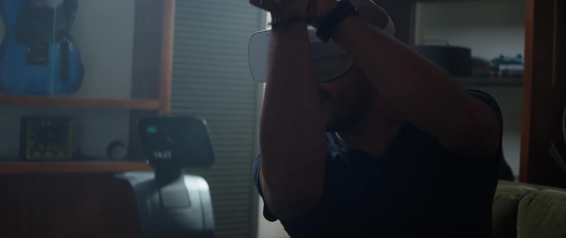 A man is playing a virtual reality sword fighting game