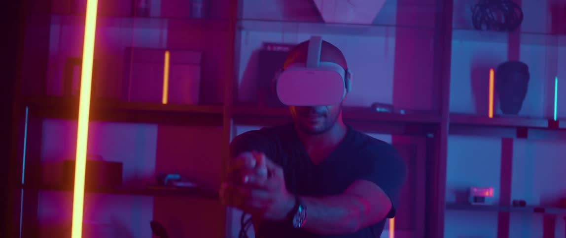 A man playing a video game using a virtual reality headset