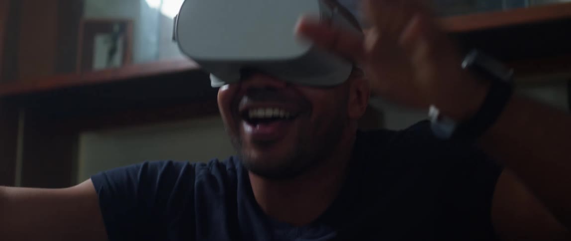 A man is playing virtual reality game indoors