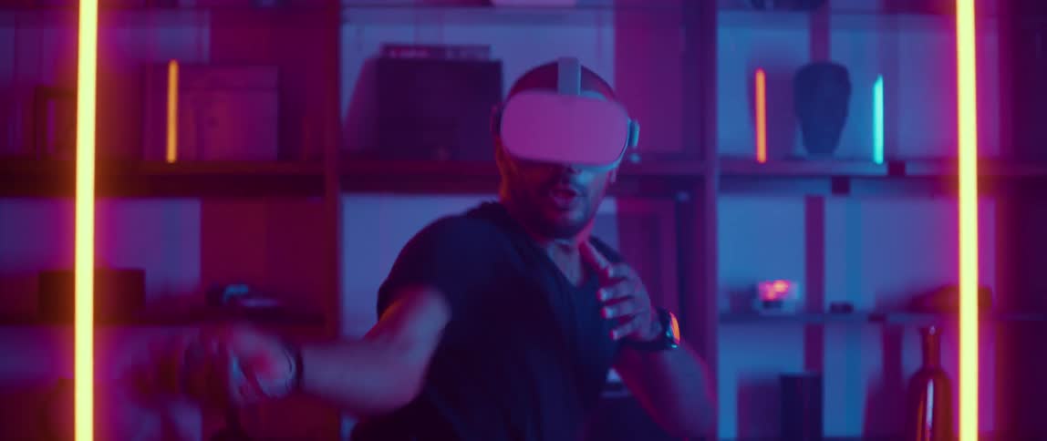 A man engaging in hand to hand combat while playing a virtual reality video game