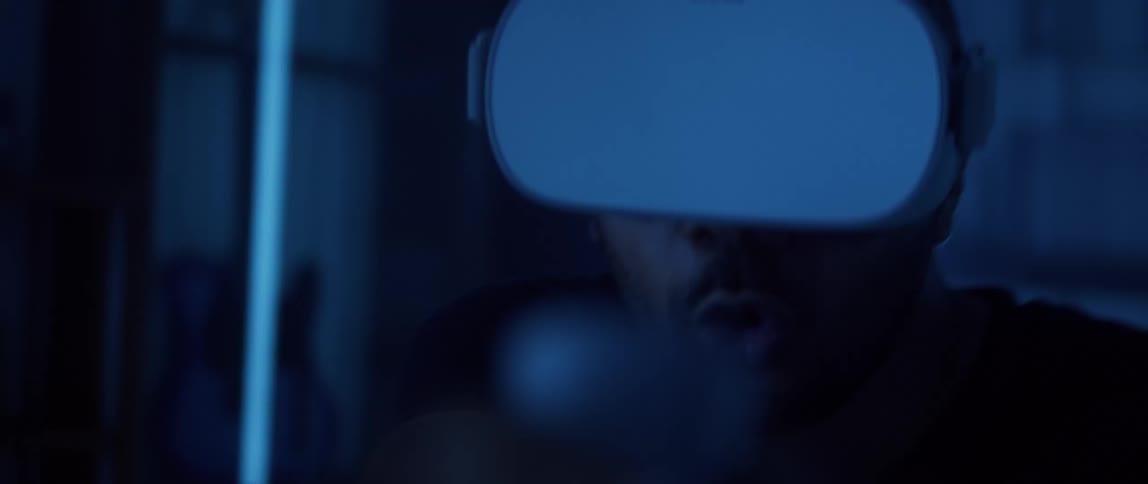 A man playing a video game using a virtual reality headset