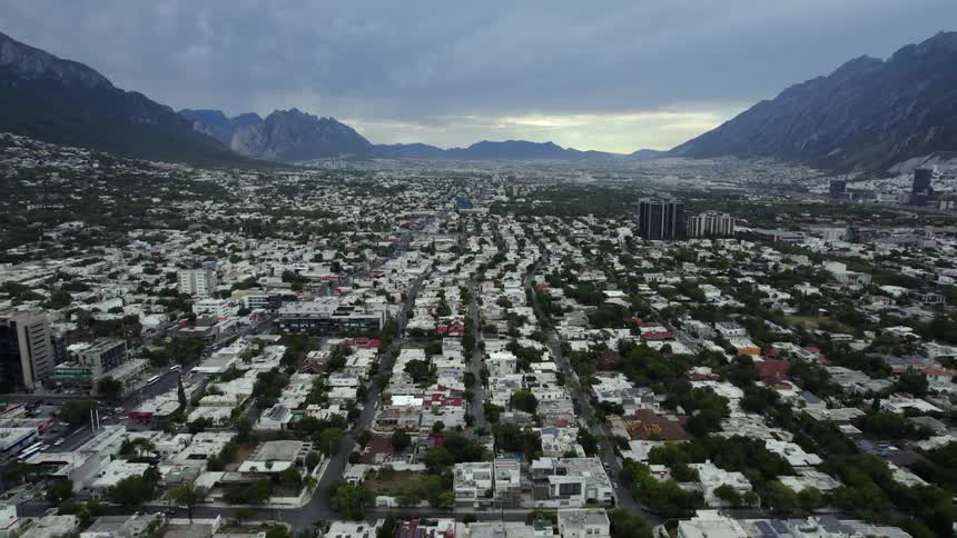 A city in a mountain valley on a cloudy day