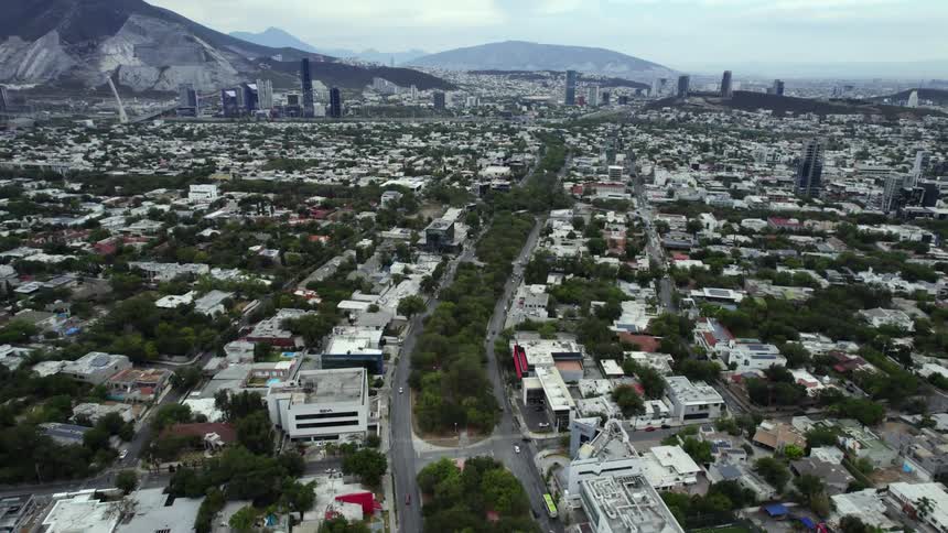 A roadway through a city during the day