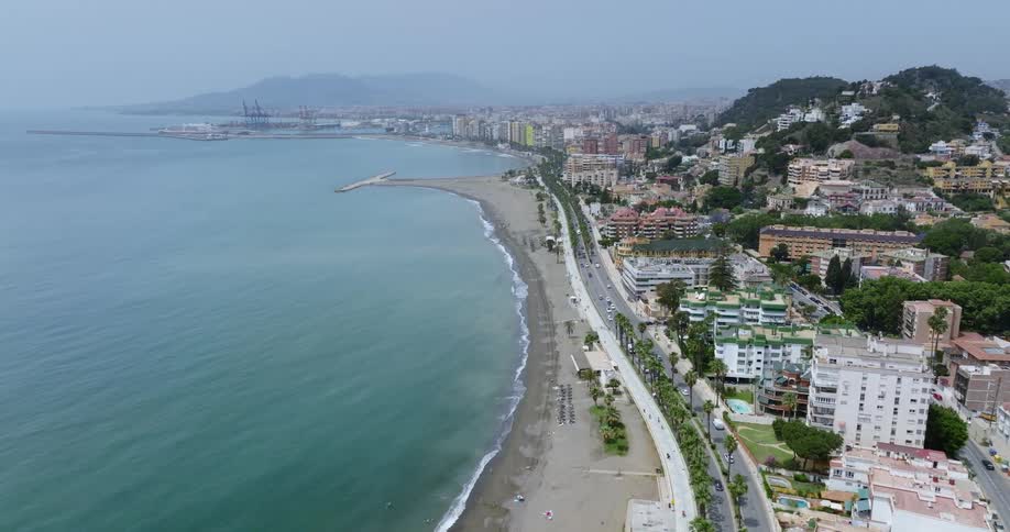 Aerial view of a coastal city and the beach during daytime