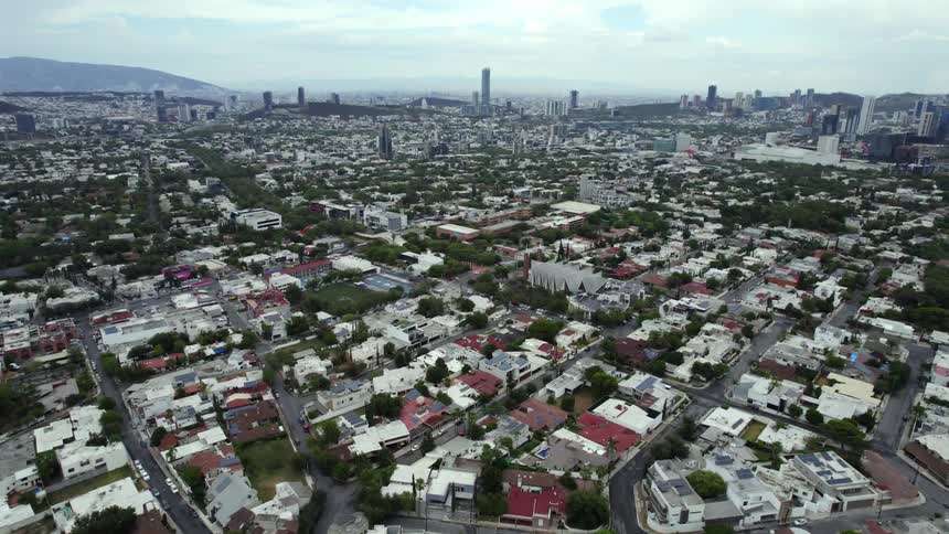 Aerial view of the extensive suburbs near the downtown city skyline at morning