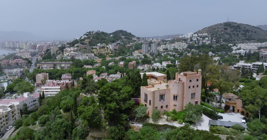 Aerial view of coastal city and buildings on hills