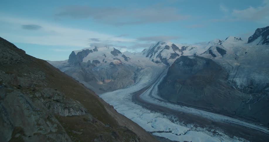 An aerial view of a mountain range and the valley below