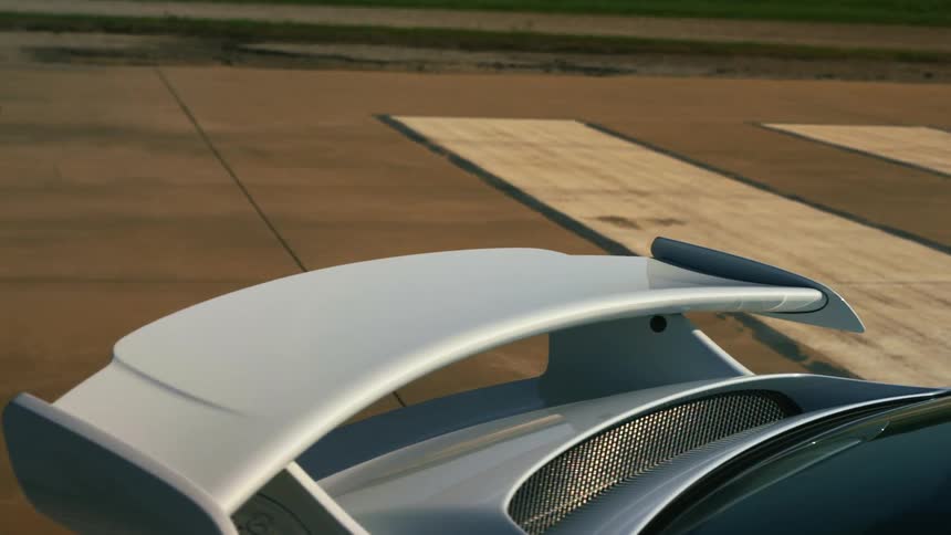 Spoiler installed over the trunk of a parked car