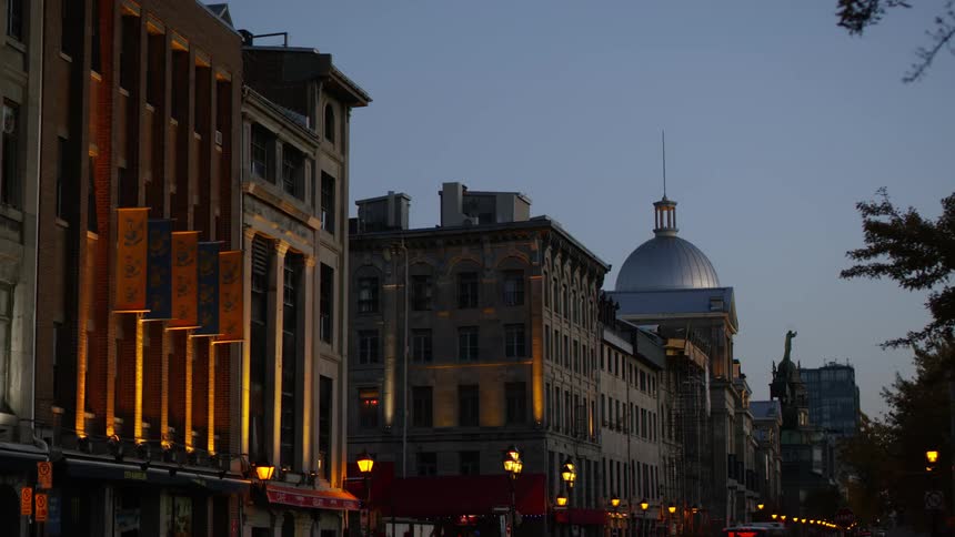 Buildings along a street in a city in the evening