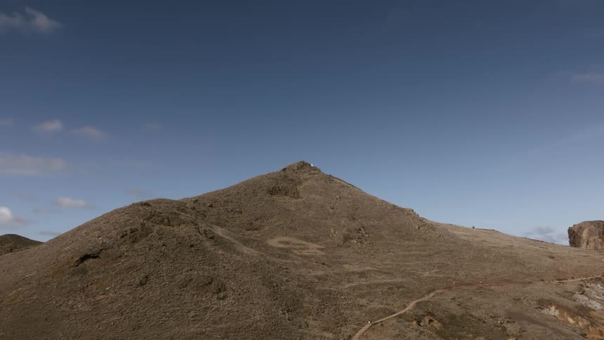 A small dirt mound on a clear day