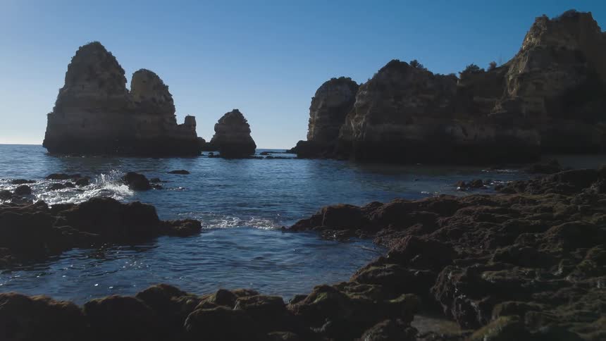 Pending view of rocks and water at a beach