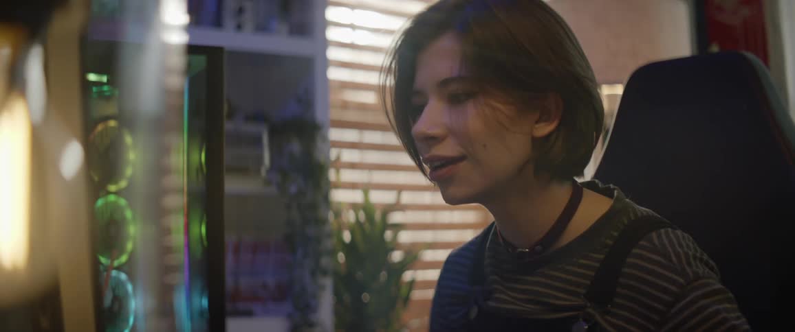 Young attractive happy woman working on a computer in her home office