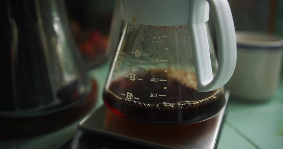 Coffee is being dripped into coffee pot
