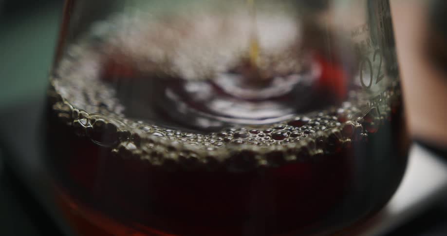 Liquid is being poured into a container