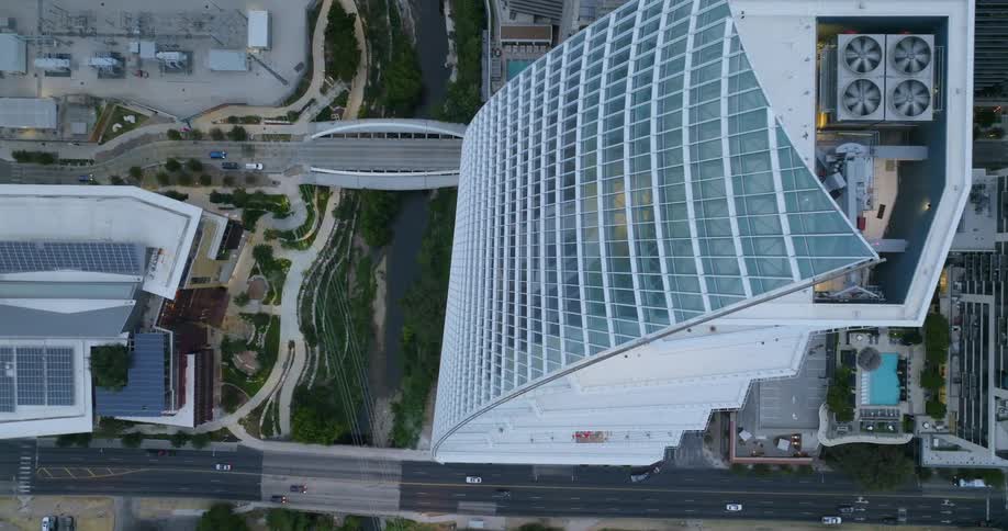 The freeway runs past the tall buildings