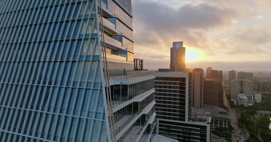 Tall buildings and skyscrapers in a metropolis in the evening