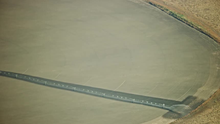 Slow zoom out revealing the massive scope of the arid west and large scale irrigation