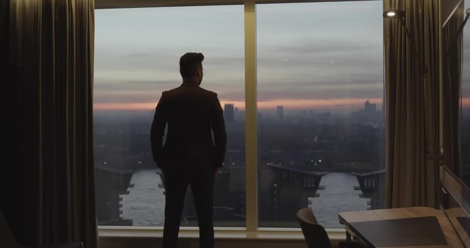 A man staring out of a window