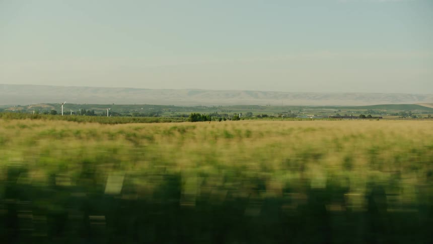 Feeding America as the stabilized camera passes by rows of corn and apple orchards