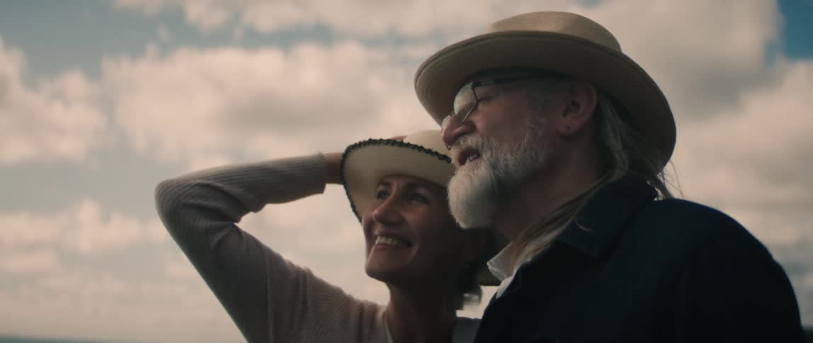 Man and woman are standing outdoors together