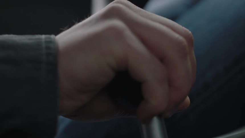 A man changes the gear of a car driving