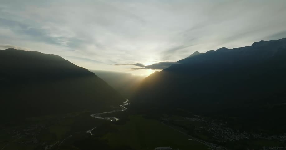 A river winds through the valley of a canyon