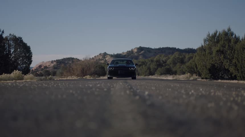 Sports car driving on a road in slow motion