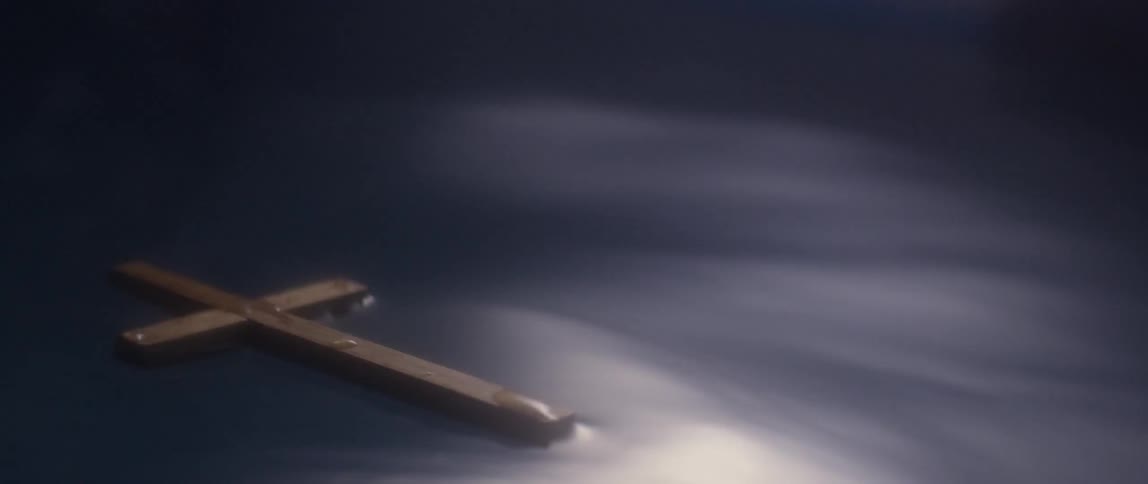 A cross is floating in the water
