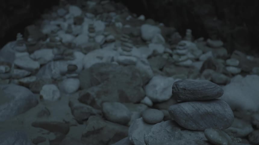 A small tower of rocks falls over