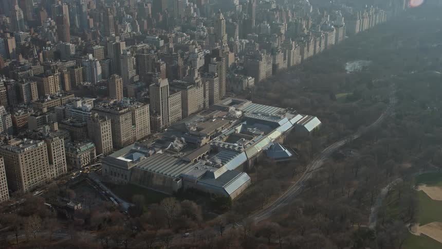 Approaching the iconic Metropolitan Museum of Art in winter with Central Park visible beneath seen on a sunny day from a birds eye view