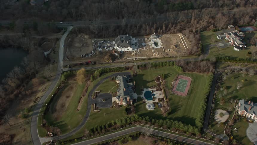 A stunning aerial view of upscale homes and mansions in Greenvale Long Island during the winter season
