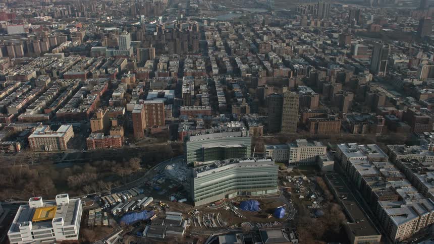 Aerial footage of urban neighborhoods in Harlem and office buildings in Manhattanville during winter