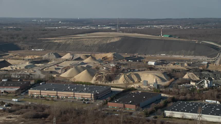 Approaching a quarry on a sunny day in Melville Long Island New York during wintertime without snow