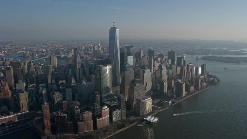 Aerial footage of Freedom Tower and surrounding skyscrapers in Lower Manhattan New York City on a misty day during winter