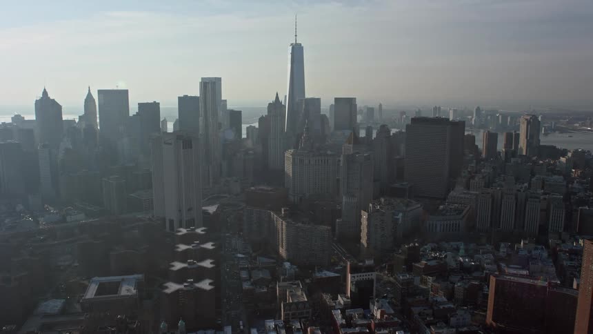 A winter aerial view of Freedom Tower and Lower Manhattans impressive skyscrapers alongside a river