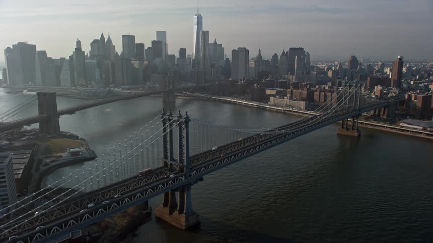 Aerial view of the Manhattan and Brooklyn Bridges with the Lower Manhattan skyline in the background on a winter day in New York City