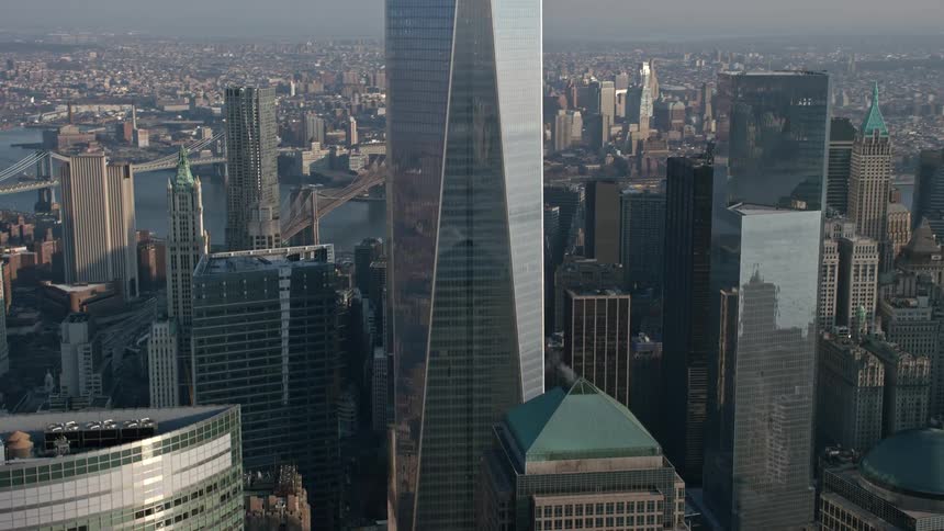 A breathtaking aerial view of One World Trade Center and other towering buildings in Lower Manhattan during winter