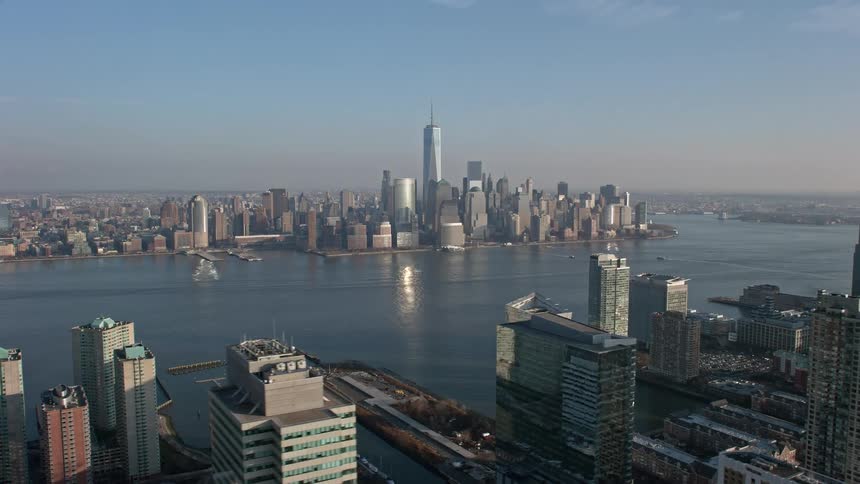 Aerial footage of the Lower Manhattan skyline viewed from across the Hudson River during winter