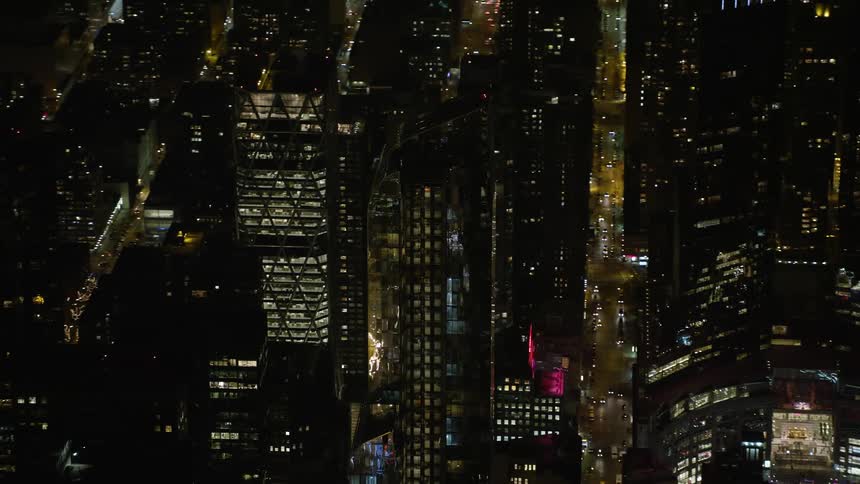 Aerial view of One57 skyscraper in Midtown Manhattan New York City at night during winter with clear skies and tracking shots
