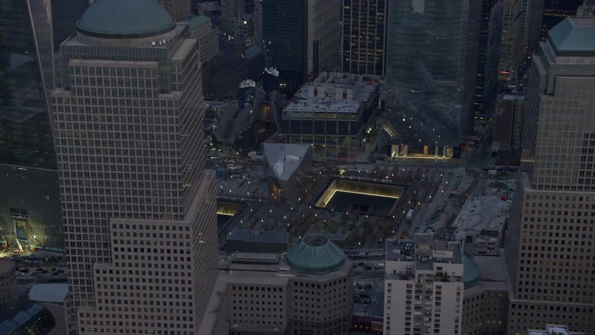 Flyby of the World Trade Center Memorial at twilight in Lower Manhattan New York City during winter