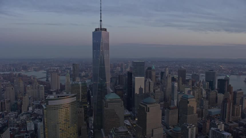 Aerial view of One World Trade Center and World Trade Center skyscrapers during twilight in Lower Manhattan New York City
