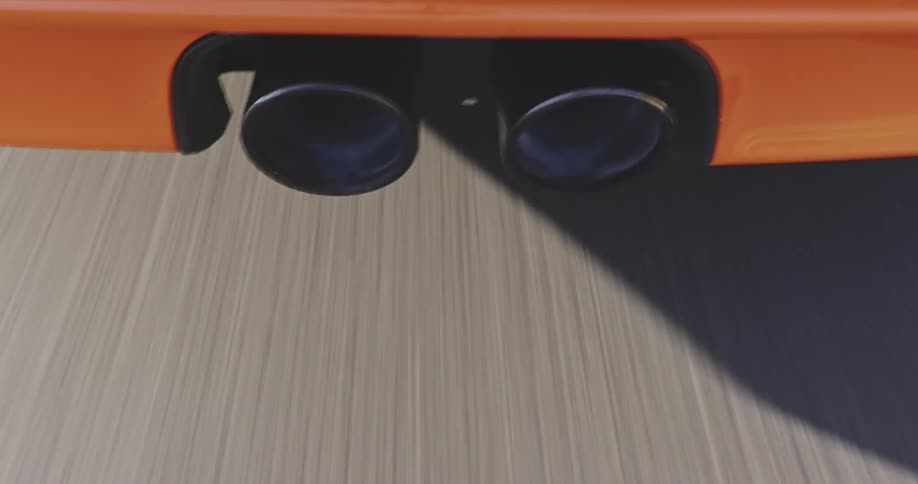 A view of exhaust on a car driving