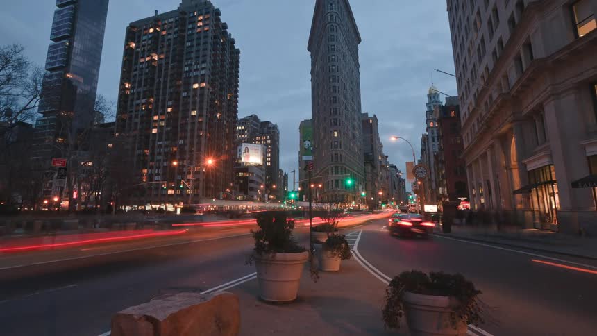 Time lapse view of traffic in a downtown city is displayed