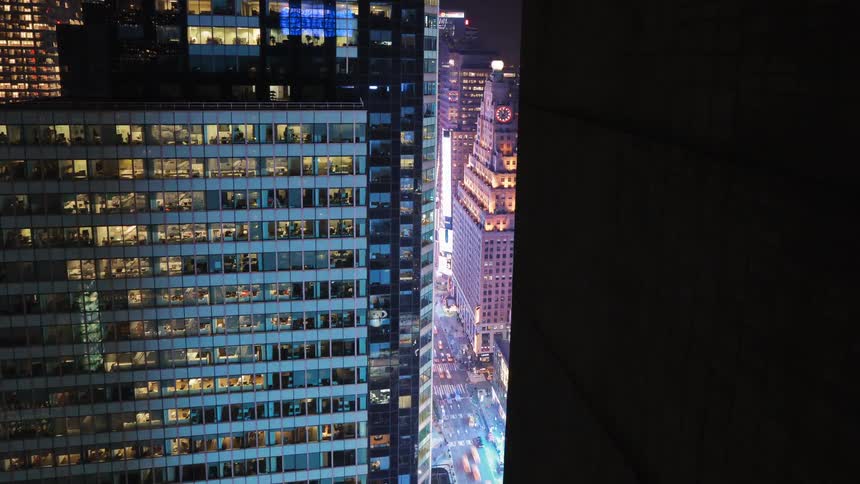 A large office building in a city near traffic