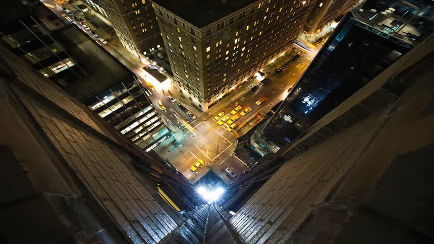 Time lapse view of cars driving through a city at night
