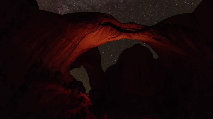 A view of an arch at night outdoors