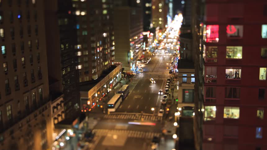 A view of cars driving in a large city